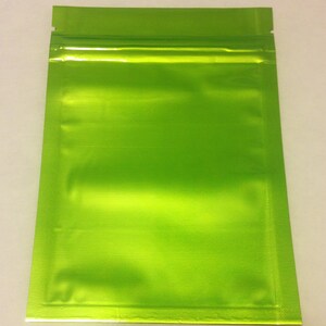 May include: A bright green resealable plastic bag with a zipper closure. The bag is made of a shiny, metallic material.