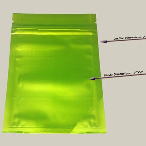 May include: A bright green, resealable plastic bag with a zipper closure. The bag is 3.5 inches by 5 inches on the outside and 3 inches by 4 inches on the inside.