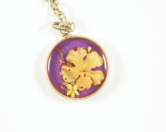 Peach verbena on purple resin fern circle necklace