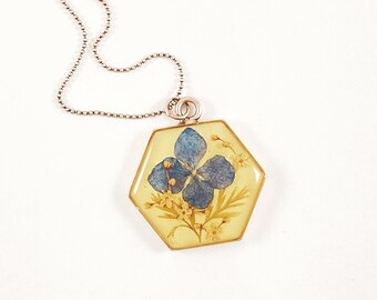 Blue hydrangea necklace with fern elderflowers on pale yellow resin in hexagon frame real dried flowers gift for hydrangea lovers