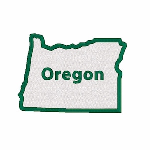 May include: A green outline of the state of Oregon with the word "Oregon" written in white inside the outline.
