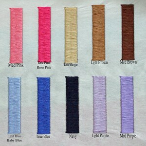 May include: A color chart featuring embroidered fabric swatches in various shades. Colors include light pink, medium pink, dark pink, tan, light brown, medium brown, dark brown, blue, purple, and navy. Each swatch has a color name label.