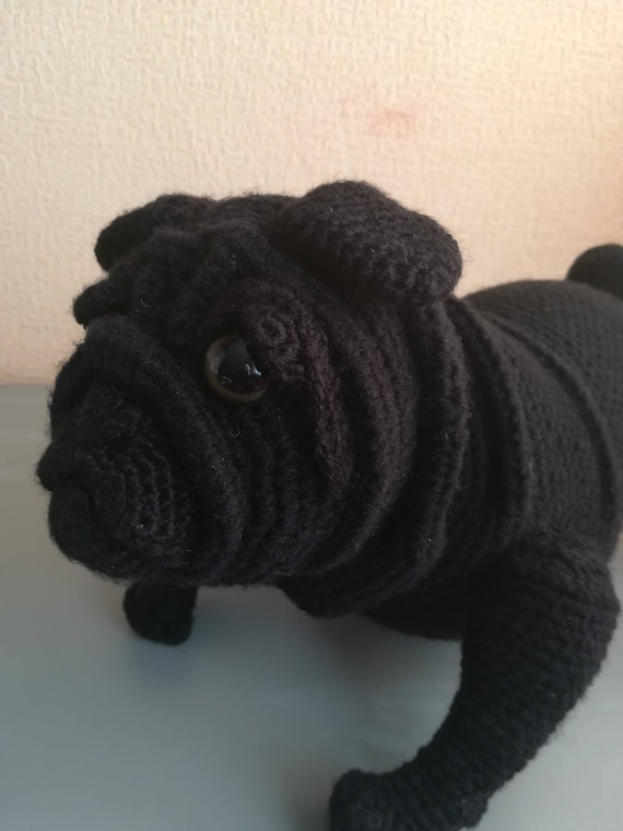 stuffed black pug dog