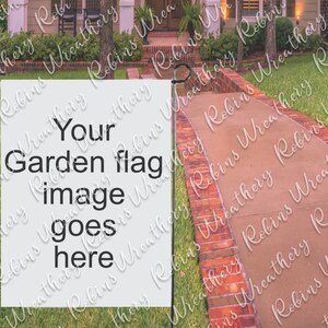 May include: A white garden flag with the text "Your Garden flag image goes here" printed in black. The flag is displayed on a metal pole in front of a brick walkway.