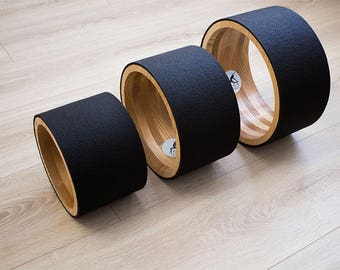 ECO Yoga wheel set 8", 10", 12". Wooden yoga wheel. Wheel covered with black yoga mat. Wooden circle