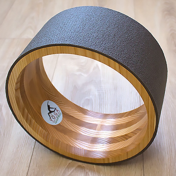 ECO Wooden Yoga Wheel covered with gray yoga mat