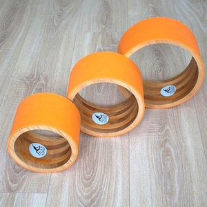 ECO Yoga wheel set 8&quot;, 10&quot;,12&quot;. Wooden yoga wheel. Wheel covered with orange yoga mat. Wooden circle