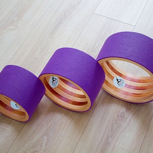 ECO Yoga wheel set 8&quot;, 10&quot;,12&quot;. Wooden yoga wheel. Wheel covered with purple yoga mat. Wooden circle