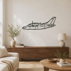 May include: A black metal wall art piece shaped like the silhouette of a twin-engine airplane. The design features a wireframe-style construction with visible outlines of the cockpit, fuselage, wings, and tail section in a flat, linear format.