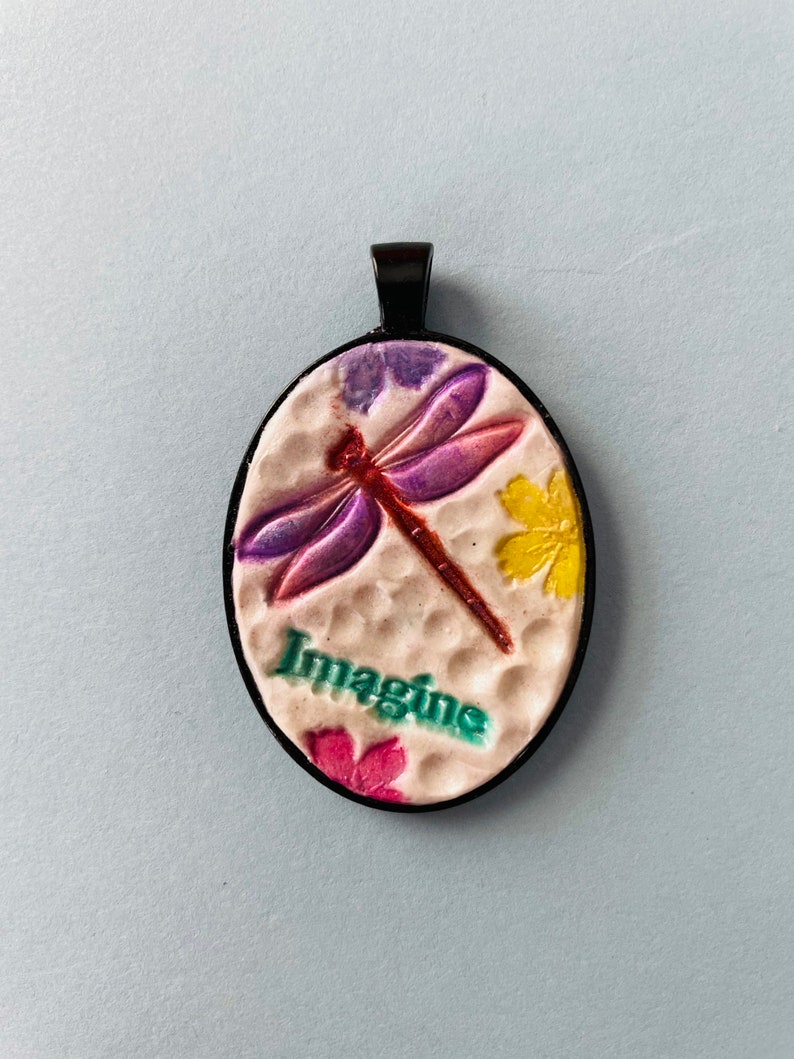 Imagine pendant with dragonfly