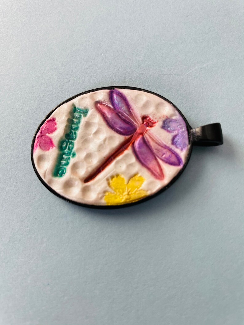 Imagine pendant with dragonfly