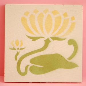 May include: A yellow flower with green leaves and stems on a white background. The flower is stylised and has a geometric design.