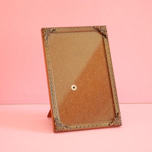 Antique metal picture frame, tin frame . Vintage rectangular picture frame. Frame stand.