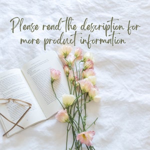 May include: A white book with a bouquet of pink and white flowers on top of a white linen fabric. The text "Please read the description for more product information" is written in green cursive on the fabric.