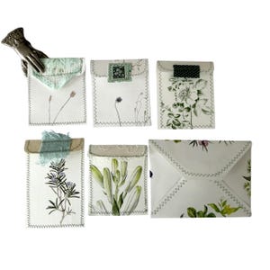 Six hand sewn botanical envelopes/pockets for journals made from vintage paper