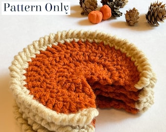 May include: A crocheted pumpkin pie with a brown crust and a white rim. The pie is cut into slices and stacked on top of each other.