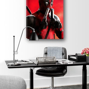 May include: A red and black superhero character with a mask and two guns, standing against a red background.