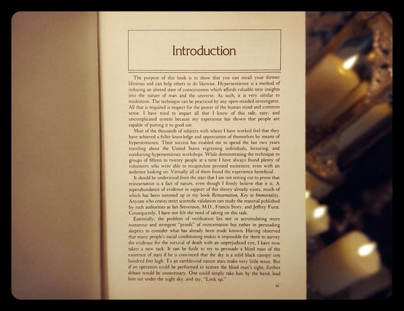 May include: A close-up of a book titled "Introduction" with text about hypersentience, a method of inducing an altered state of consciousness. The book discusses the nature of man and the universe, and the power of the human mind.