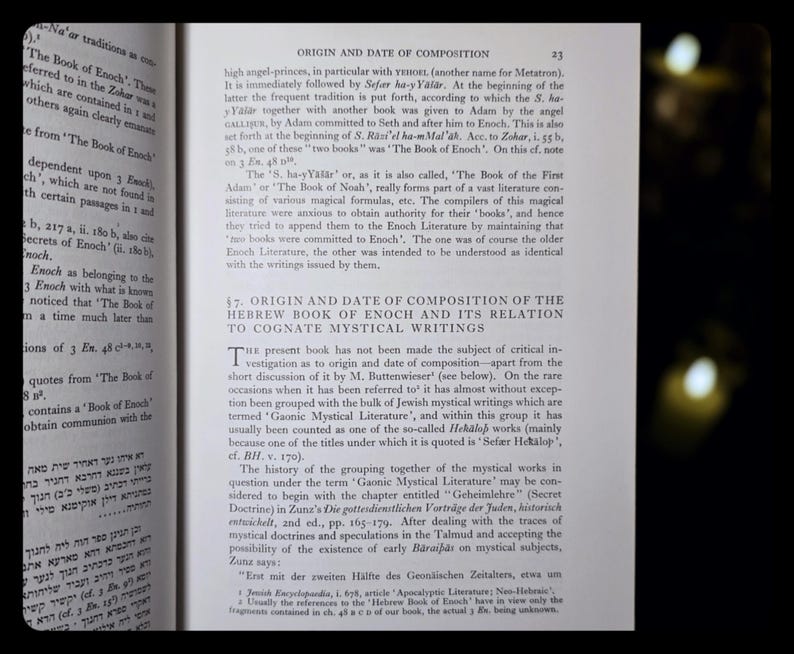May include: An open book with text in English and Hebrew. The page shows a section titled "ORIGIN AND DATE OF COMPOSITION" with detailed text. The book appears to be a scholarly work on religious texts.