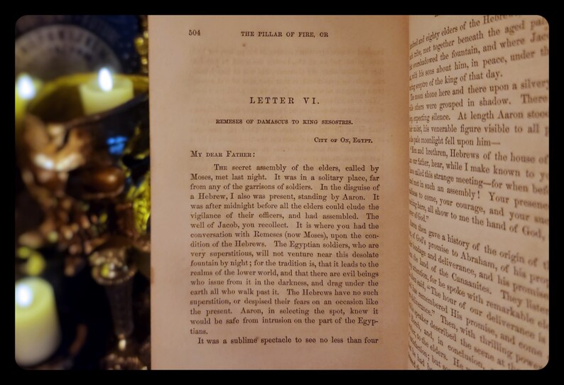 May include: A page from a book titled "The Pillar of Fire, or" with the text "Letter VI. Remeses of Damascus to King Resorthis. City of On, Egypt." The text describes a secret assembly of elders called by Moses, who met at night in a solitary place far from any of the garrisons of soldiers.