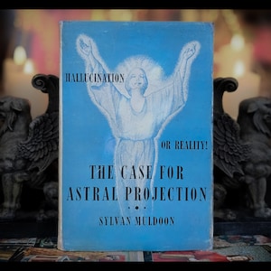 May include: A blue book titled "The Case for Astral Projection: Hallucination or Reality!" by Sylvan Muldoon. The cover features a drawing of a person with arms raised.