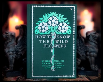 May include: A green book titled "How to Know the Wild Flowers" by Mrs. Starr William Dana with 25 new paintings by C. Saito. The cover features a stylised illustration of a white flower with green leaves.