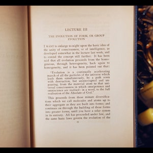 May include: A page from a book titled "Lecture III: The Evolution of Form, or Group Evolution." The text discusses the concept of evolution and how it proceeds from the homogeneous, through heterogeneity, back again to homogeneity. The text also mentions the "continually accelerating march of all the particles of the universe."