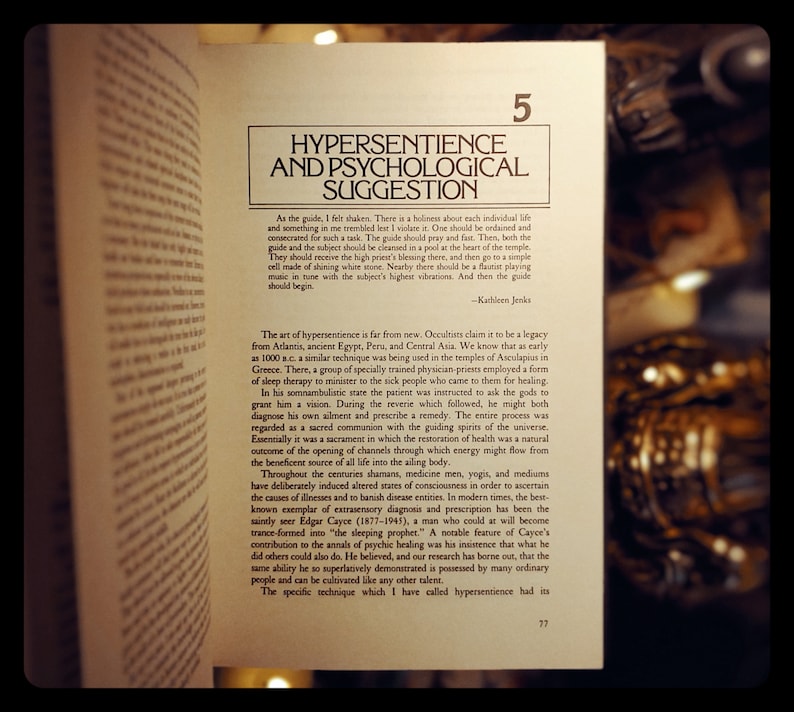 May include: A close-up of a book page with the title "Hypersentience and Psychological Suggestion." The text discusses the history of hypersentience and its use in healing.