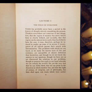 May include: A page from a book titled "Lecture I: The Field of Evolution". The text discusses the history of thought and the evolution of mystery. The page number is 11.