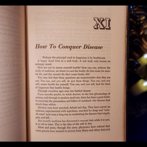 May include: A page from a book titled "How To Conquer Disease" with the text "Perhaps the principal road to happiness is by healthiness. A happy mind lives in a well body. A sick body only houses an unhappy mind."