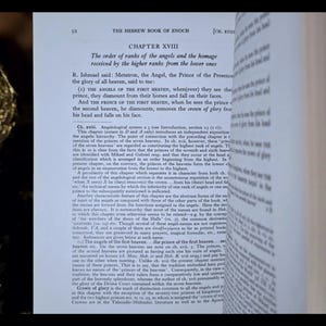 May include: An open book displaying text from "The Hebrew Book of Enoch," Chapter XVIII. The page shows a discussion on the order of angels. The text is in black on a white background.