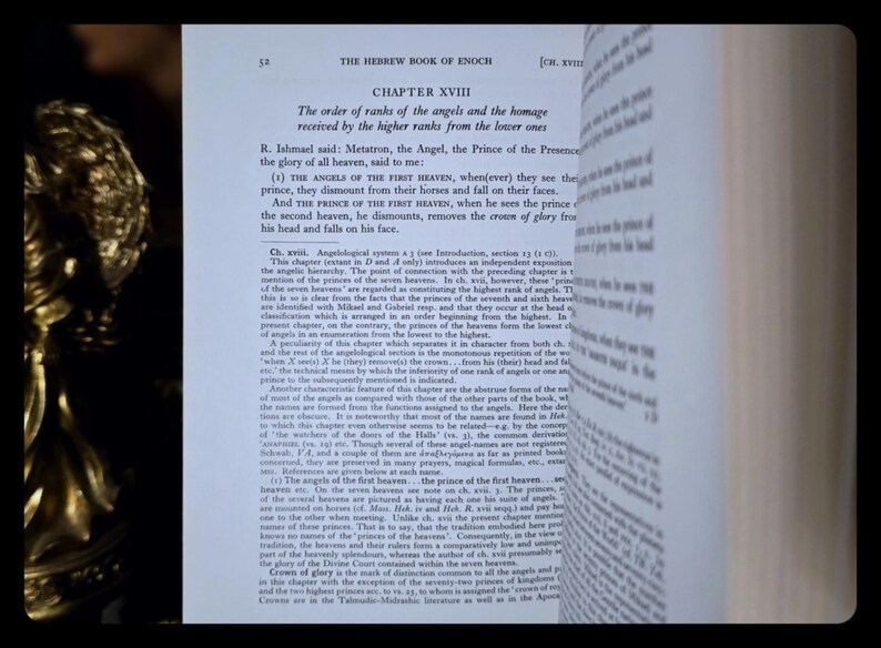 May include: An open book displaying text from "The Hebrew Book of Enoch," Chapter XVIII. The page shows a discussion on the order of angels. The text is in black on a white background.