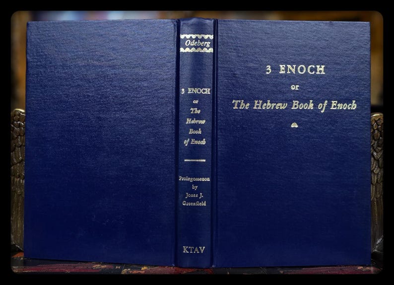 May include: A dark blue hardcover book, titled "3 Enoch or The Hebrew Book of Enoch", with gold lettering. The spine displays the title, author, and publisher, "KTAV". The book is held open, revealing the title.