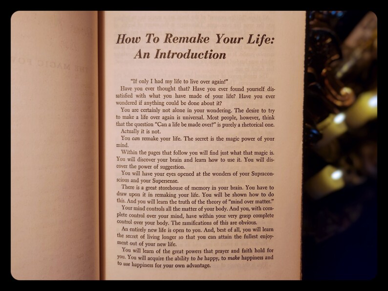 May include: A close-up of a book titled "How To Remake Your Life: An Introduction". The book is open to a page with text about the power of the mind and how to use it to remake your life.