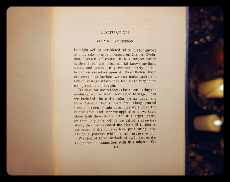 May include: A page from a book titled "Lecture VII: Cosmic Evolution". The text discusses the evolution of the atom from stage to stage, including the entire solar system. The text is printed in black ink on a white page.