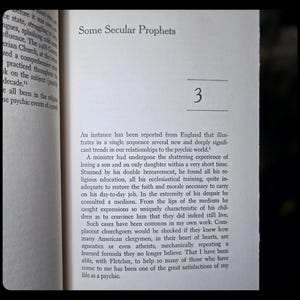 May include: Open book page with the title "Some Secular Prophets" and the number "3" in a serif font. The text discusses psychic phenomena and religious figures. The page is slightly yellowed.