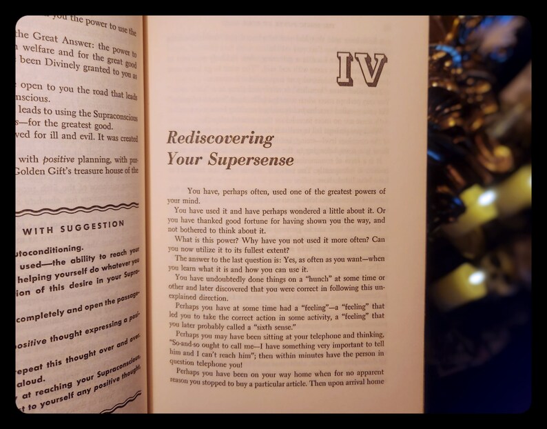 May include: A book titled "Rediscovering Your Supersense" with the Roman numeral IV on the cover. The book is open to a page with the title "Rediscovering Your Supersense" and text about using the power of your mind.