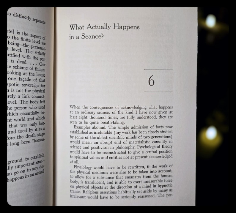 May include: Open book page with text: "What Actually Happens in a Seance?" and the number "6". The text is in black font on a cream-colored page. The book is slightly angled.