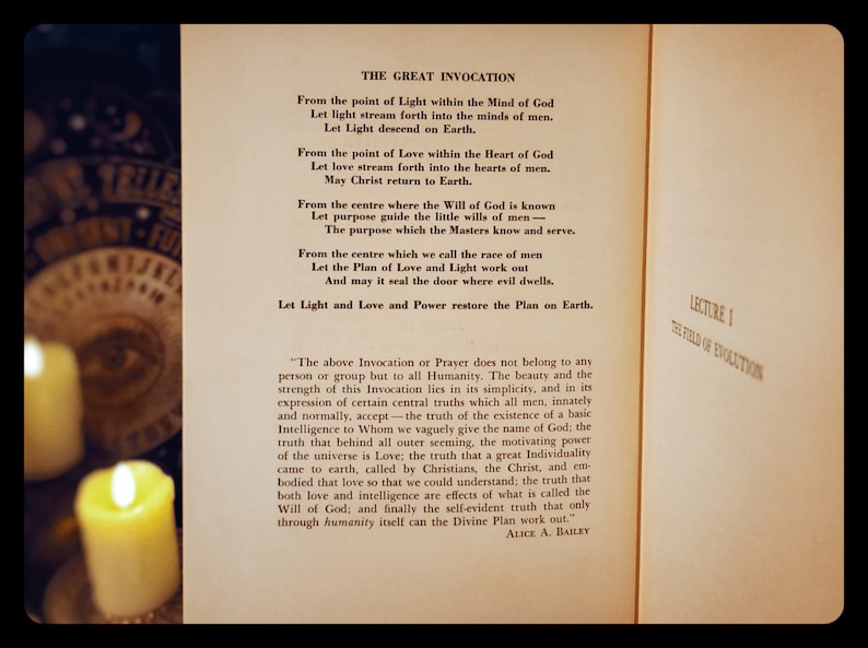 May include: A vintage book with a yellowed page featuring a text titled "The Great Invocation". The text is a prayer or invocation for peace and light. The book is open and the pages are slightly curled at the edges.