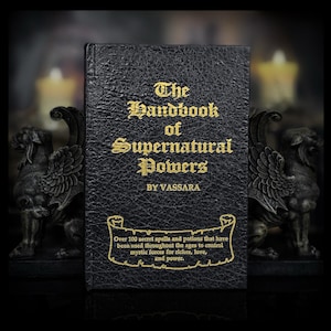 May include: A black book titled The Handbook of Supernatural Powers by Vassara with gold embossed lettering on the cover. The text includes a description of over 100 secret spells and potions for riches, love, and power inside a scroll graphic.
