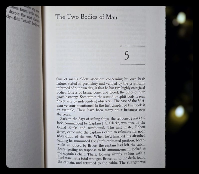 May include: Open book page with text titled "The Two Bodies of Man" and the number "5". The text describes the concept of two human bodies, one physical and one energetic, with examples from history.