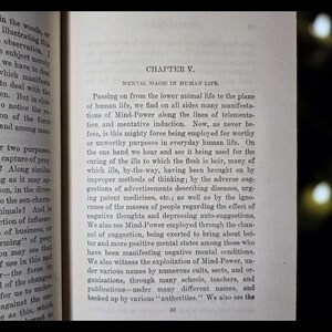 May include: Open book with text on aged paper. The page displays the title "CHAPTER V. MENTAL MAGIC IN HUMAN LIFE." The text discusses mind-power and its applications in human life, with the number 57 at the bottom of the page.