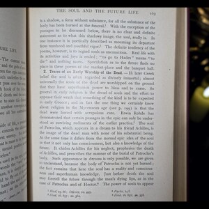 May include: A close-up of a page from a book titled "The Soul and the Future Life." The text discusses the concept of the soul in ancient Greek mythology and the belief in the afterlife. The page is yellowed with age and has a worn, vintage look.