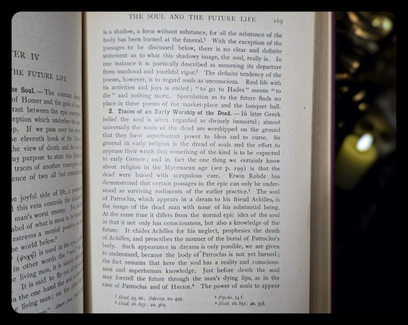 May include: A close-up of a page from a book titled "The Soul and the Future Life." The text discusses the concept of the soul in ancient Greek mythology and the belief in the afterlife. The page is yellowed with age and has a worn, vintage look.