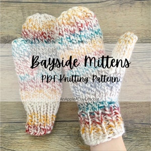May include: A pair of colourful knitted mittens with a white background and a multi-coloured yarn pattern. The mittens are called "Bayside Mittens PDF Knitting Pattern" and are available from AnAppleADayCrochet.