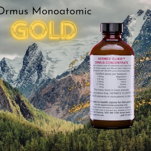 Puede incluir: Una botella de vidrio marr&oacute;n con tapa negra, etiquetada "HERMES' ELIXIR ORMUS CONCENTRATE", sobre un fondo de cordillera y bosque. El texto "Ormus Monoatomic GOLD" est&aacute; en la parte superior.