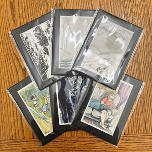 May include: A collection of framed art prints, each in a black mat and sealed in clear plastic. The artwork includes various illustrations in black and white and color, depicting scenes of nature, figures, and interior settings.