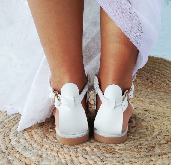 White beach shop sandals