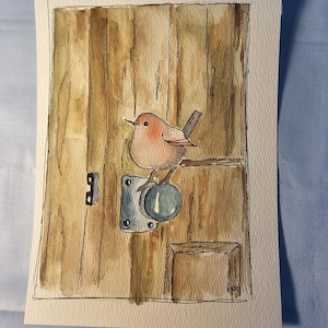 May include: A white ceramic mug with a black handle and the text "But First, Coffee" in a bold, black font. The mug is set against a neutral background, highlighting its simple design.