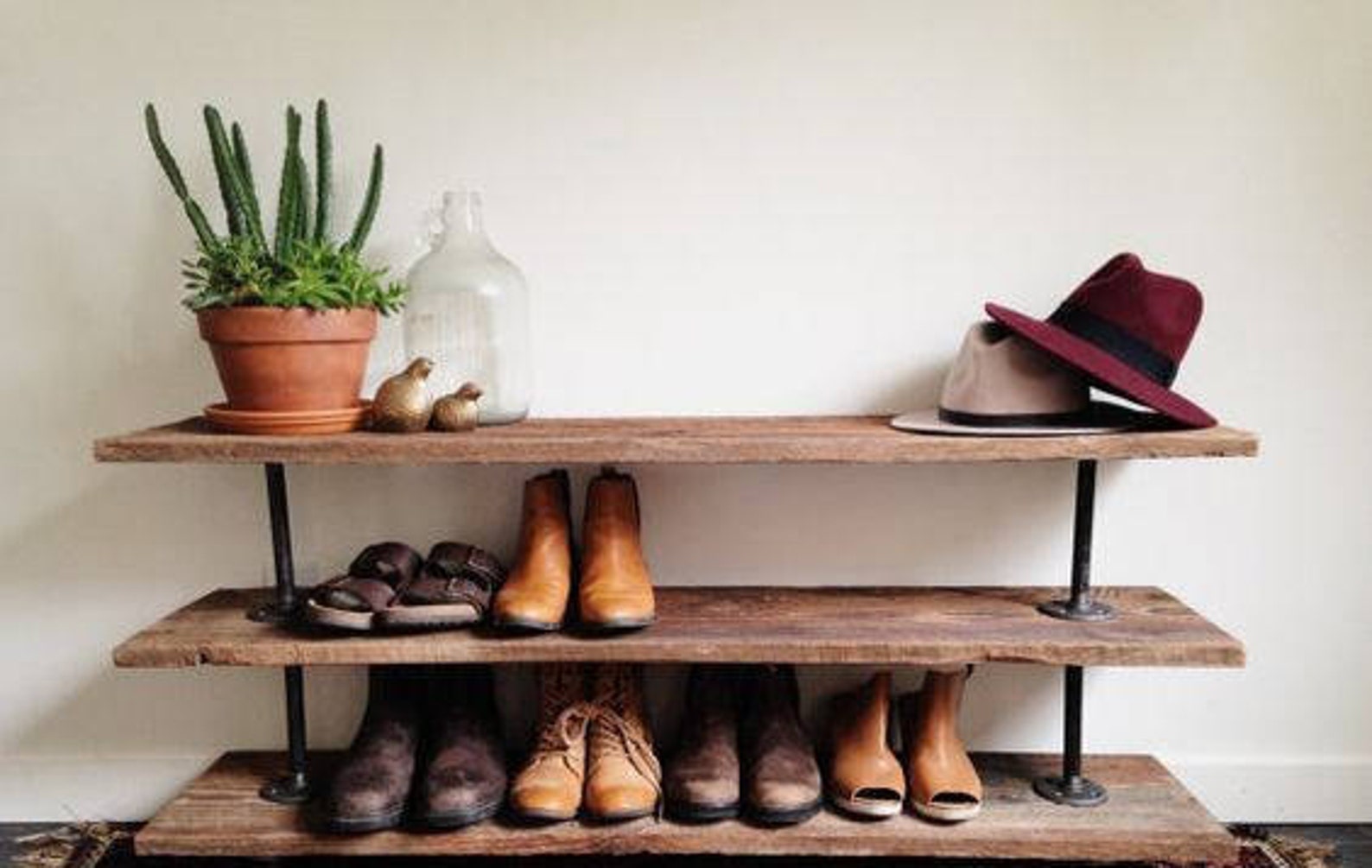 A brown three-tiered shoe rack